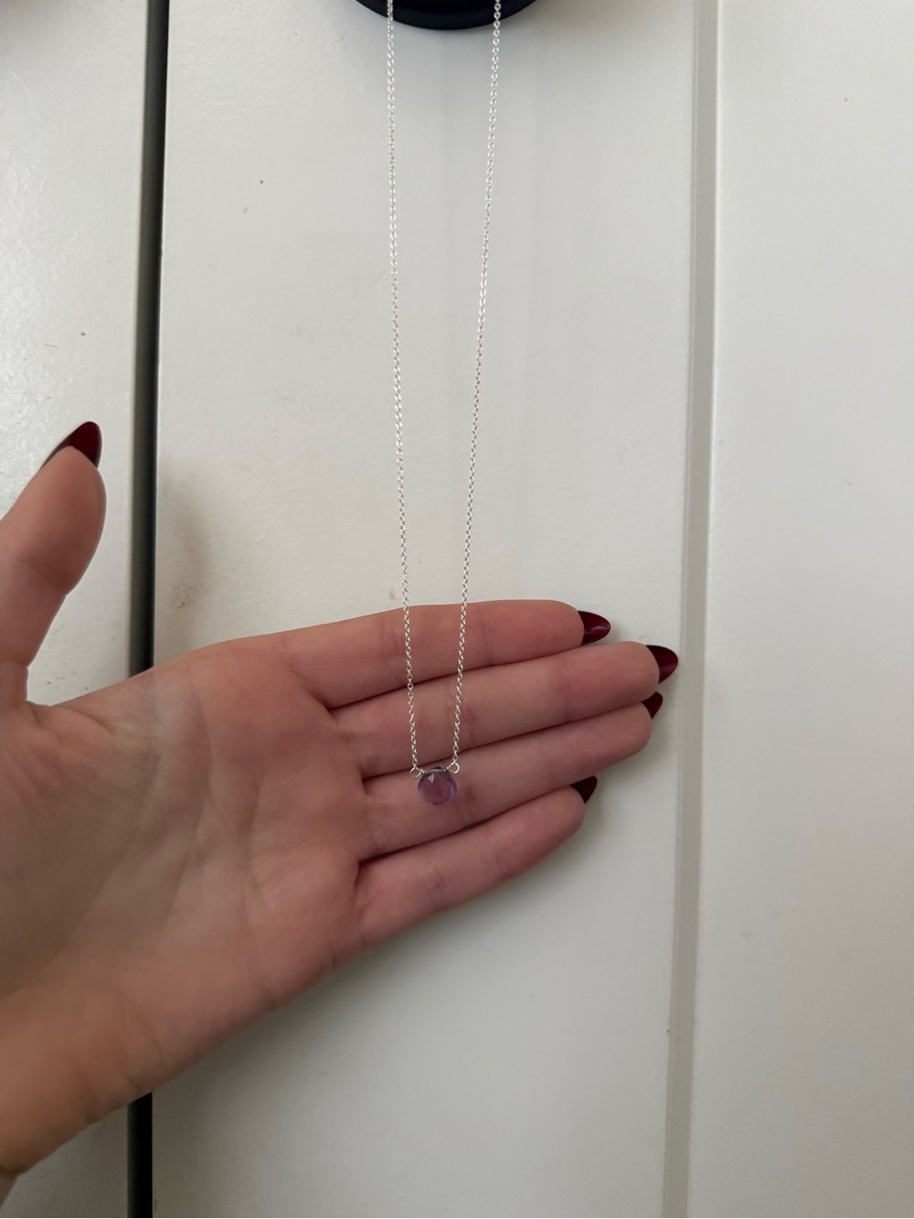 silver necklace with amethyst pendent